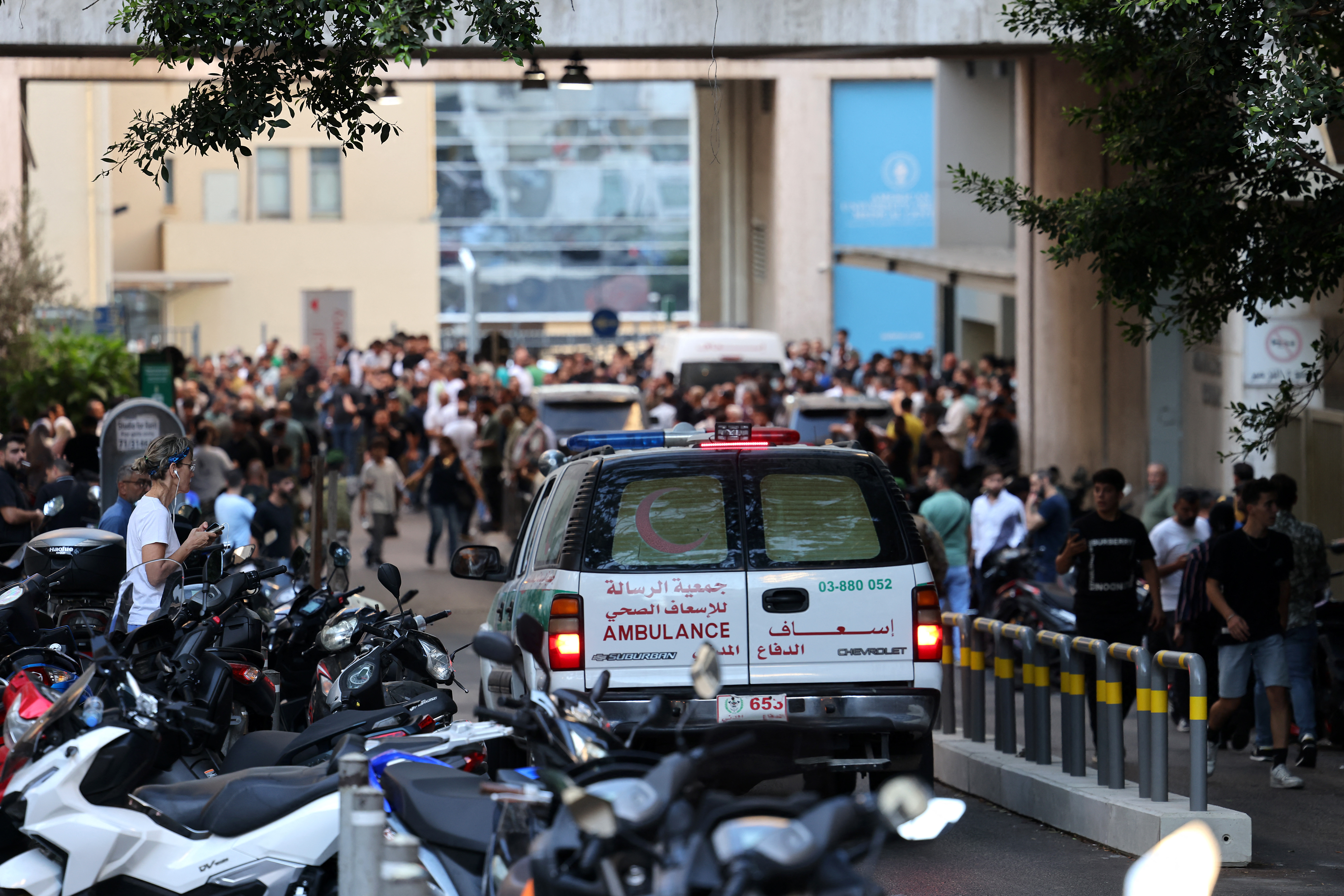 An ambulance rushes wounded people to the American University of Beirut Medical Center, on September 17, 2024, after explosions hit locations in several areas around Lebanon amid ongoing cross-border tensions between Israel and Hezbollah fighters. Hundreds of people were wounded when Hezbollah members' paging devices exploded simultaneously across Lebanon on September 17, in what a source close to the militant movement said was an "Israeli breach" of its communications. (AFP)