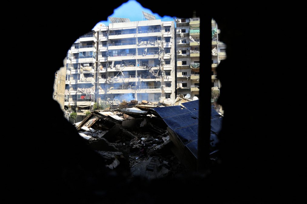 Smoke billows from the rubble of a building destroyed in an Israeli airstrike on a neighborhood in Beirut's southern suburbs on October 2, 2024. (AFP)