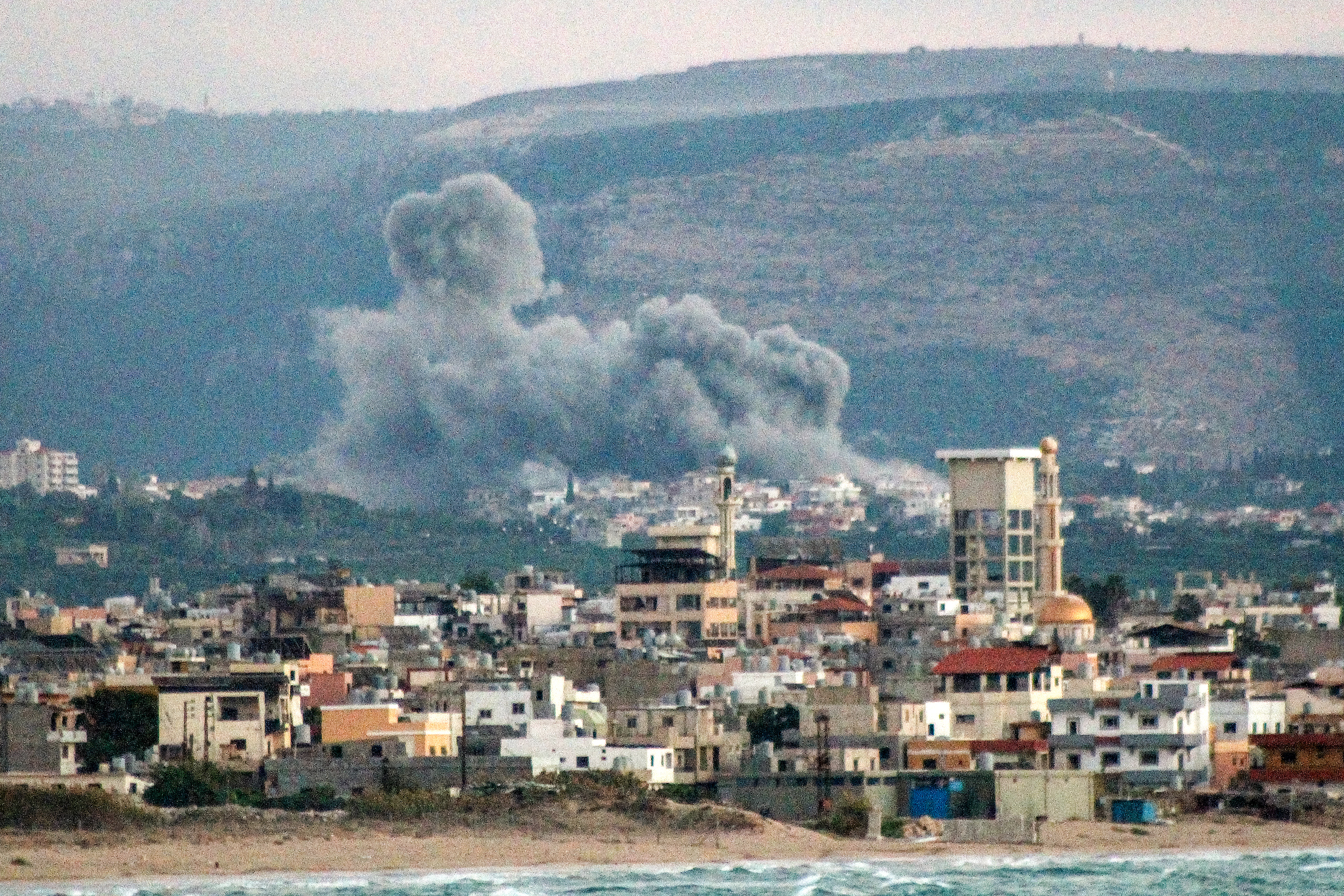 This overview from Lebanon's southern city of Tyre shows a cloud of smoke erupting after an Israeli air strike on the village of Qlayleh on September 30, 2024. (AFP)